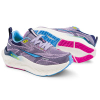 Pair of running shoes with purple, blue, and pink design on a white background