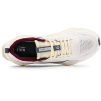 White athletic shoe with red accents on a white background