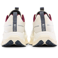 Pair of white sneakers with maroon accents and visible branding on a white background
