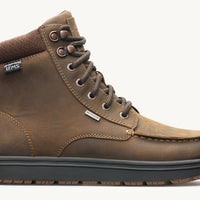 Brown leather boot with black sole on a white background