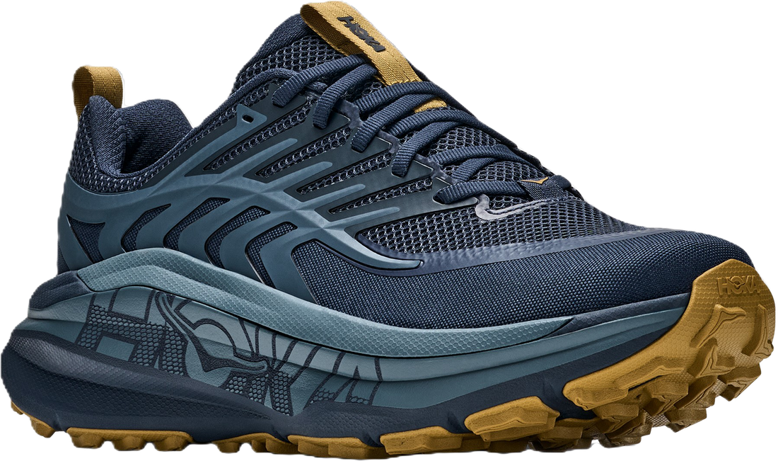 A Hoka trail running shoe in navy blue and slate gray with tan accents on the pull tabs, outsole, and logo.
