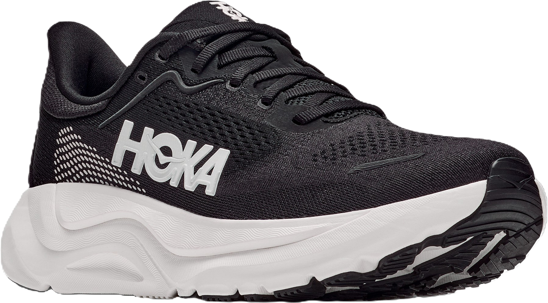 A black Hoka running shoe with a thick white midsole and white HOKA branding on the side, shown against a plain white background.