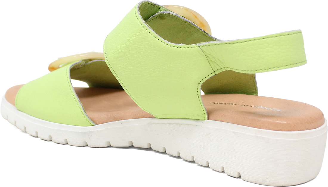Green sandal with a white sole on a white background