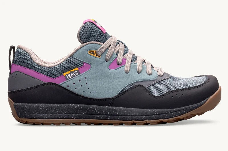 Blue and gray sneaker with purple accents on a white background